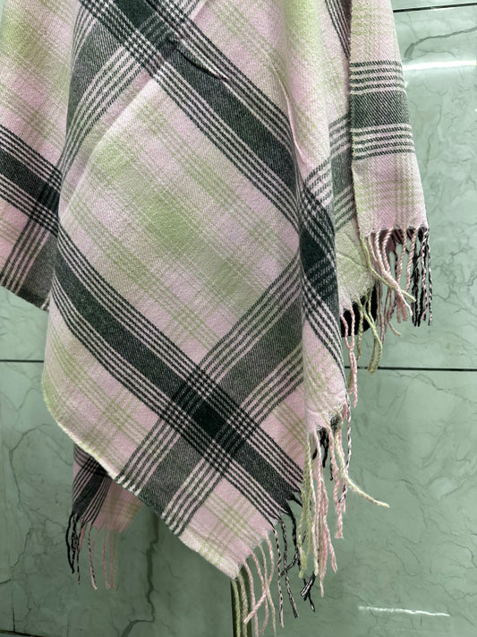 he mix of soft pastel pink with those structured grey and tan checks gives it a perfect balance of "cozy" and "sophisticated."