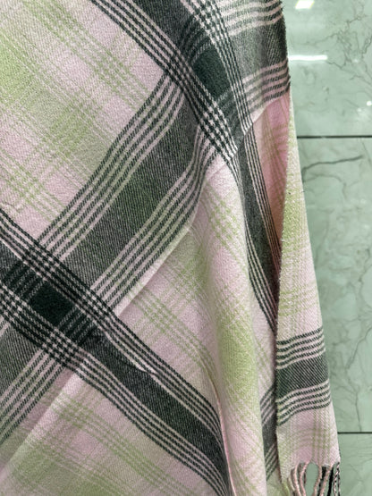 he mix of soft pastel pink with those structured grey and tan checks gives it a perfect balance of "cozy" and "sophisticated."