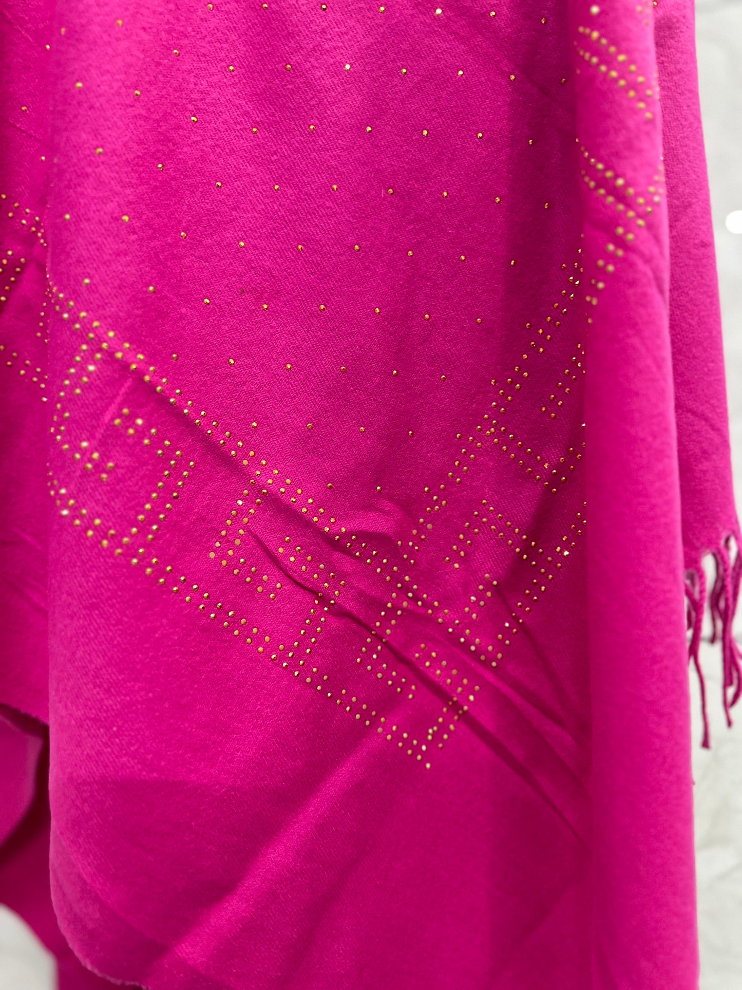 The vibrant magenta combined with the delicate gold stone work gives it a very luxurious, "royal" feel.
